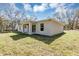Backyard featuring a new gray home at 1205 2Nd St, Orange City, FL 32763