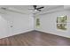 Spacious bedroom with tray ceiling, sleek flooring, and natural light at 1205 2Nd St, Orange City, FL 32763