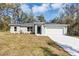 Charming single-story home with a two-car garage and neatly manicured lawn at 1205 2Nd St, Orange City, FL 32763