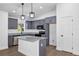 Modern kitchen featuring gray cabinets, granite countertops, and stainless steel appliances at 1205 2Nd St, Orange City, FL 32763