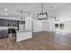 Open-concept living room with modern lighting and sleek flooring at 1205 2Nd St, Orange City, FL 32763