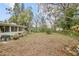 Large backyard with mature trees and landscaping at 139 Floridana Rd, Debary, FL 32713