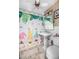 Clean bathroom with a pedestal sink and whimsical shower curtain at 139 Floridana Rd, Debary, FL 32713