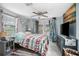Comfortable bedroom featuring a ceiling fan and backyard access at 139 Floridana Rd, Debary, FL 32713