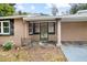 Inviting front porch with ornate entry door at 139 Floridana Rd, Debary, FL 32713