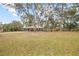 Large front yard with mature trees and landscaping at 139 Floridana Rd, Debary, FL 32713