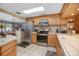 Bright kitchen with stainless steel appliances and wood cabinets at 139 Floridana Rd, Debary, FL 32713