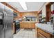 Kitchen features stainless steel appliances and wood cabinets at 139 Floridana Rd, Debary, FL 32713