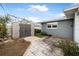 Backyard patio with storage shed and clothesline at 15 Longfellow Cir, Ormond Beach, FL 32176
