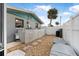 Landscaped backyard with shed and privacy fence at 15 Longfellow Cir, Ormond Beach, FL 32176