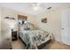 Bedroom with a full-size bed and wood furniture at 15 Longfellow Cir, Ormond Beach, FL 32176