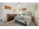Bright bedroom with a double bed and dresser at 15 Longfellow Cir, Ormond Beach, FL 32176