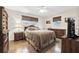 Cozy bedroom with tiled floors, a double bed, and wood furniture at 15 Longfellow Cir, Ormond Beach, FL 32176