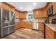 Updated kitchen with stainless steel appliances and wood cabinets at 15 Longfellow Cir, Ormond Beach, FL 32176