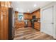 Modern kitchen with wood cabinets, granite countertops, and stainless steel appliances at 15 Longfellow Cir, Ormond Beach, FL 32176