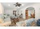 Open living room with hardwood floors and a view to the kitchen at 15 Longfellow Cir, Ormond Beach, FL 32176