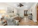 Spacious living room with hardwood floors and comfy seating at 15 Longfellow Cir, Ormond Beach, FL 32176