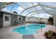Relaxing screened pool area, perfect for outdoor enjoyment at 15 Longfellow Cir, Ormond Beach, FL 32176