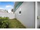 Landscaped side yard with privacy fence and gate at 15 Longfellow Cir, Ormond Beach, FL 32176