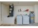 Laundry room with washer, dryer, and ample storage at 1520 3Rd Ave, Deland, FL 32724