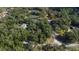 Aerial view of a residential lot surrounded by trees at 163 Laurelwood Ln, Ormond Beach, FL 32174