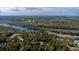 Wide aerial view showcasing waterfront property and homes at 163 Laurelwood Ln, Ormond Beach, FL 32174
