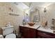 Powder room with glass bowl sink, decorative walls and dark wood vanity at 163 Laurelwood Ln, Ormond Beach, FL 32174