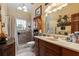 Bathroom with shower, vanity, and decorative wall art at 163 Laurelwood Ln, Ormond Beach, FL 32174