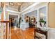Spacious entryway with hardwood floors and a double staircase at 163 Laurelwood Ln, Ormond Beach, FL 32174