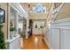 Two-story entryway with hardwood floors and a grand staircase at 163 Laurelwood Ln, Ormond Beach, FL 32174