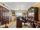 Spacious home office features built-in shelving and wood flooring at 163 Laurelwood Ln, Ormond Beach, FL 32174