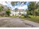 Two-story house with a stone facade and landscaping at 163 Laurelwood Ln, Ormond Beach, FL 32174