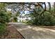 Two-story house with a stone facade and landscaping at 163 Laurelwood Ln, Ormond Beach, FL 32174