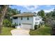 Two-story house with attached garage and landscaped yard at 163 Laurelwood Ln, Ormond Beach, FL 32174