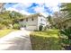 Two-story house with a white exterior and large yard at 163 Laurelwood Ln, Ormond Beach, FL 32174