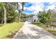 Two-story house with a white exterior and large yard at 163 Laurelwood Ln, Ormond Beach, FL 32174