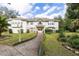 Two-story house with a stone facade and landscaping at 163 Laurelwood Ln, Ormond Beach, FL 32174