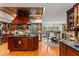 Open kitchen with island, breakfast nook, and pool view at 163 Laurelwood Ln, Ormond Beach, FL 32174