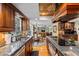 Kitchen with granite countertops, stainless steel appliances, and a view into the dining area at 163 Laurelwood Ln, Ormond Beach, FL 32174