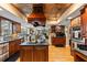 Large kitchen with island, stainless steel appliances, and wood cabinets at 163 Laurelwood Ln, Ormond Beach, FL 32174