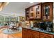 Kitchen with breakfast nook, wood cabinets, and granite counters at 163 Laurelwood Ln, Ormond Beach, FL 32174