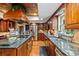 Gourmet kitchen with stainless steel appliances and granite island at 163 Laurelwood Ln, Ormond Beach, FL 32174