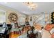 Living room with hardwood floors, a piano, and elegant decor at 163 Laurelwood Ln, Ormond Beach, FL 32174