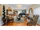 Living room with comfortable seating, hardwood floors, and large windows at 163 Laurelwood Ln, Ormond Beach, FL 32174