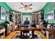 Home office, featuring custom built-in shelves and a large desk at 163 Laurelwood Ln, Ormond Beach, FL 32174