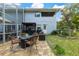 Charming patio area with seating and pergola at 163 Laurelwood Ln, Ormond Beach, FL 32174