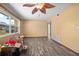 Empty living room with wood-look floors and ceiling fan at 1707 Palm Ave, Deland, FL 32724