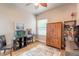 Bright bedroom with a window, wood flooring, and built-in wooden wardrobe at 1734 Covendale Ln, Port Orange, FL 32128