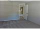 Large bedroom with carpet flooring and access to another room at 1848 Ridgewood St, Deland, FL 32720