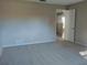 Large bedroom with carpeted floors and neutral color palette at 1848 Ridgewood St, Deland, FL 32720